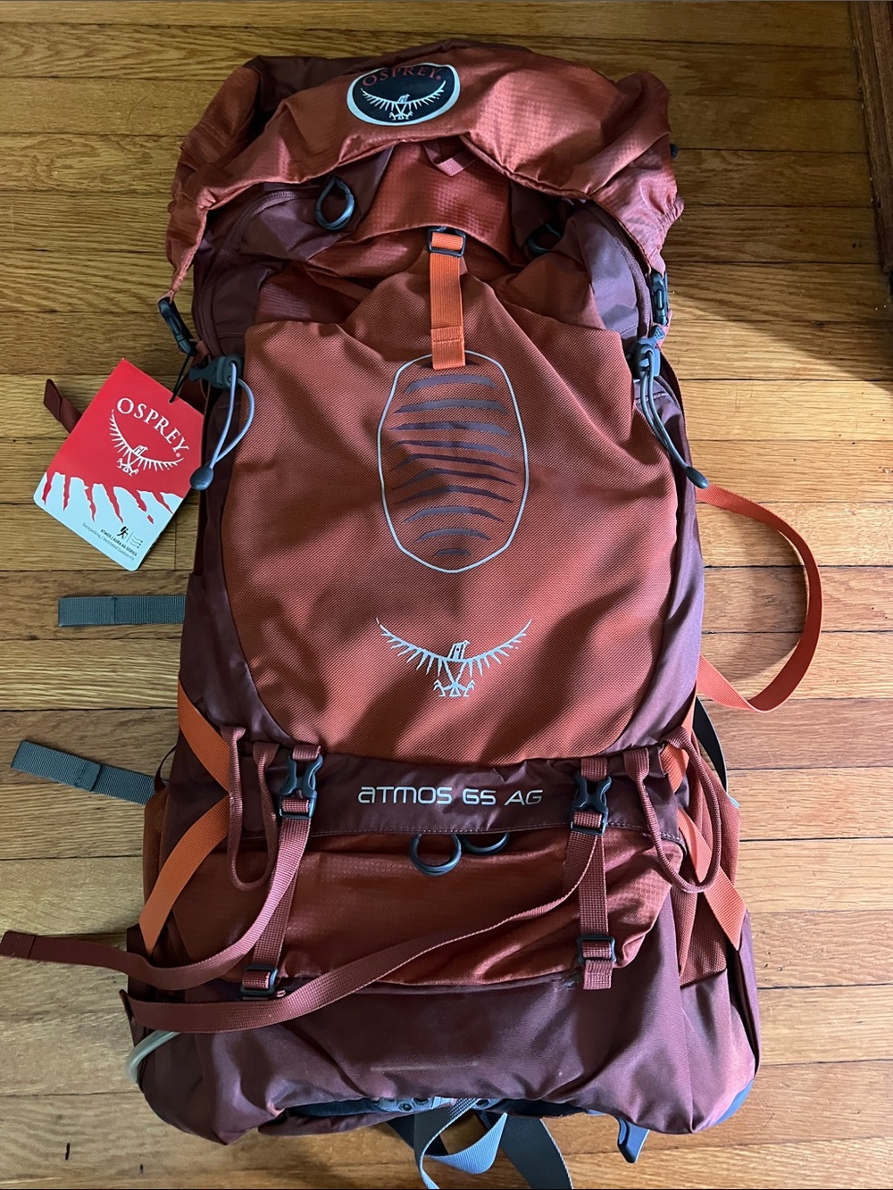 OSPREY Atmos 65 AG Backpack in rust and burgundy